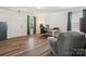Bright room featuring wood floors, a desk, an office chair, and a large window at 13314 Pontchatrain Ave, Charlotte, NC 28273
