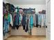 Well-organized walk-in closet with ample hanging space and storage shelves for clothing and accessories at 13314 Pontchatrain Ave, Charlotte, NC 28273