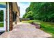 Spacious paved backyard patio with brick border and stone bench seating at 141 Aberdeen Dr, Troutman, NC 28166