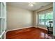 Bright bedroom featuring hardwood floors, a ceiling fan, a window, and ample natural light at 141 Aberdeen Dr, Troutman, NC 28166