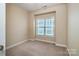Bedroom with carpet floor, neutral walls, window, and base trim at 141 Aberdeen Dr, Troutman, NC 28166