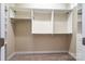 Walk-in closet featuring custom white shelving, carpeting, and adjustable metal rods at 141 Aberdeen Dr, Troutman, NC 28166