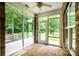 Bright and airy sunroom with brick walls and tiled floor, perfect for relaxation at 141 Aberdeen Dr, Troutman, NC 28166