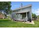 Back exterior of home with a deck, grill, and a view of the backyard at 162 Castles Gate Dr, Mooresville, NC 28117