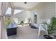 Cozy back porch with outdoor seating, plants, and elegant curtains for a relaxing outdoor experience at 171 Old Harbor Dr, Mount Gilead, NC 27306