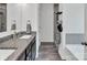 Modern bathroom featuring granite countertop, dark wood cabinets, and a stylish shower with a tiled surround at 171 Old Harbor Dr, Mount Gilead, NC 27306