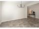 A dining room features hardwood floors and a modern chandelier at 171 Old Harbor Dr, Mount Gilead, NC 27306