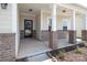 Charming front porch with brick accents and ample space for seating and decor at 171 Old Harbor Dr, Mount Gilead, NC 27306
