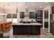Modern kitchen featuring dark cabinetry, stainless steel appliances, and a large center island at 171 Old Harbor Dr, Mount Gilead, NC 27306