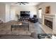 Spacious living room with fireplace, tv, and comfortable seating arrangement at 171 Old Harbor Dr, Mount Gilead, NC 27306