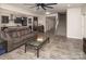 Open-concept living area with a kitchen, staircase, and comfortable seating, offering a spacious feel at 171 Old Harbor Dr, Mount Gilead, NC 27306