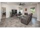 Bright living room featuring a fireplace, comfortable seating, large windows, and stylish decor at 171 Old Harbor Dr, Mount Gilead, NC 27306