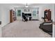 Spacious office with large windows, built-in bookshelves, and carpeted floors perfect for working from home at 171 Old Harbor Dr, Mount Gilead, NC 27306