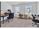 Home office space with large windows and carpeted floor, perfect for maximizing your productivity at 171 Old Harbor Dr, Mount Gilead, NC 27306