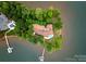 Aerial view of an expansive lakefront property with mature trees and private dock access at 173 Rehoboth Ln, Mooresville, NC 28117