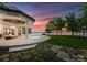 Backyard exterior view with a pool, green grass, and sunset at 173 Rehoboth Ln, Mooresville, NC 28117
