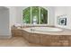 Bathroom features a large garden tub underneath a large arched window at 173 Rehoboth Ln, Mooresville, NC 28117