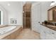 Bathroom featuring a soaking tub and tiled walk-in shower at 173 Rehoboth Ln, Mooresville, NC 28117