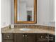 Bathroom vanity features granite countertops and a large framed mirror at 173 Rehoboth Ln, Mooresville, NC 28117