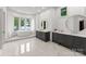Bright bathroom with large soaking tub, marble floors, and double vanities at 173 Rehoboth Ln, Mooresville, NC 28117