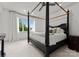 Bedroom with a four-poster bed and a large window at 173 Rehoboth Ln, Mooresville, NC 28117