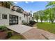 Back exterior view of the home with an attached garage and lake views at 173 Rehoboth Ln, Mooresville, NC 28117