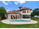 Aerial view of the home's exterior with a backyard pool, lakeside frontage, and a covered patio at 173 Rehoboth Ln, Mooresville, NC 28117