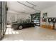 Spacious garage with tiled floors, glass doors, and car at 173 Rehoboth Ln, Mooresville, NC 28117