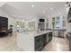 Open-concept kitchen with an island, stainless steel appliances, and access to the lake view at 173 Rehoboth Ln, Mooresville, NC 28117