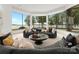 Bright living room with floor to ceiling windows, offering amazing lake views at 173 Rehoboth Ln, Mooresville, NC 28117
