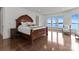 Main bedroom with wood floors and lake views from the large windows at 173 Rehoboth Ln, Mooresville, NC 28117