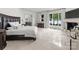 Bright main bedroom with hardwood floors, large windows, and lake views at 173 Rehoboth Ln, Mooresville, NC 28117