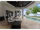 Inviting outdoor patio with lounge chairs, a pool, and beautiful lake views at 173 Rehoboth Ln, Mooresville, NC 28117