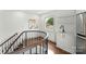Upstairs landing features a wet bar, small fridge and beautiful wood staircase at 173 Rehoboth Ln, Mooresville, NC 28117