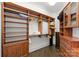Walk-in closet with wood cabinets and shelves and hardwood floors at 173 Rehoboth Ln, Mooresville, NC 28117