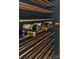Close up of wine storage with brown wooden shelves and blue paint at 173 Rehoboth Ln, Mooresville, NC 28117