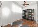 Bright yoga room with hardwood floors, natural light, and built-in shelving at 173 Rehoboth Ln, Mooresville, NC 28117