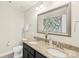 Bathroom featuring a double sink vanity, granite countertops, and large mirror at 1830 Alden Oaks Ln, Charlotte, NC 28270