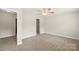 Spacious bedroom with neutral walls, carpet, ceiling fan and closet at 1830 Alden Oaks Ln, Charlotte, NC 28270