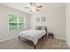 Bedroom with neutral paint, carpet, large window and ceiling fan at 1830 Alden Oaks Ln, Charlotte, NC 28270