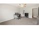 Bedroom featuring neutral walls, carpet, ceiling fan and a desk setup at 1830 Alden Oaks Ln, Charlotte, NC 28270