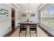 Formal dining room with tray ceiling, modern decor, and wainscoting detail at 1830 Alden Oaks Ln, Charlotte, NC 28270