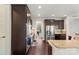 Kitchen with stainless steel appliances, dark wood cabinets, and granite countertops at 1830 Alden Oaks Ln, Charlotte, NC 28270