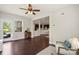 Open-concept living room features hardwood floors, natural light, and access to an outdoor deck at 1830 Alden Oaks Ln, Charlotte, NC 28270