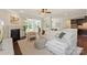 Open-concept living room featuring a fireplace, hardwood floors, and lots of natural light at 1830 Alden Oaks Ln, Charlotte, NC 28270