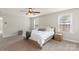 Main bedroom with carpet flooring, a ceiling fan, and ample natural light at 1830 Alden Oaks Ln, Charlotte, NC 28270