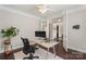 Cozy office space featuring a modern desk, ergonomic chair, and decorative plant at 1830 Alden Oaks Ln, Charlotte, NC 28270