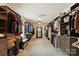 Spacious walk-in closet with built-in shelving, ample storage, and carpet flooring at 1830 Alden Oaks Ln, Charlotte, NC 28270