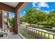 Relaxing balcony showcasing views of the street, green trees and landscaping, and bright blue skies at 1903 Kenilworth Ave # 104A, Charlotte, NC 28203