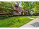 Beautiful brick building with well-maintained landscaping, manicured shrubs, and lush green grass at 1903 Kenilworth Ave # 104A, Charlotte, NC 28203